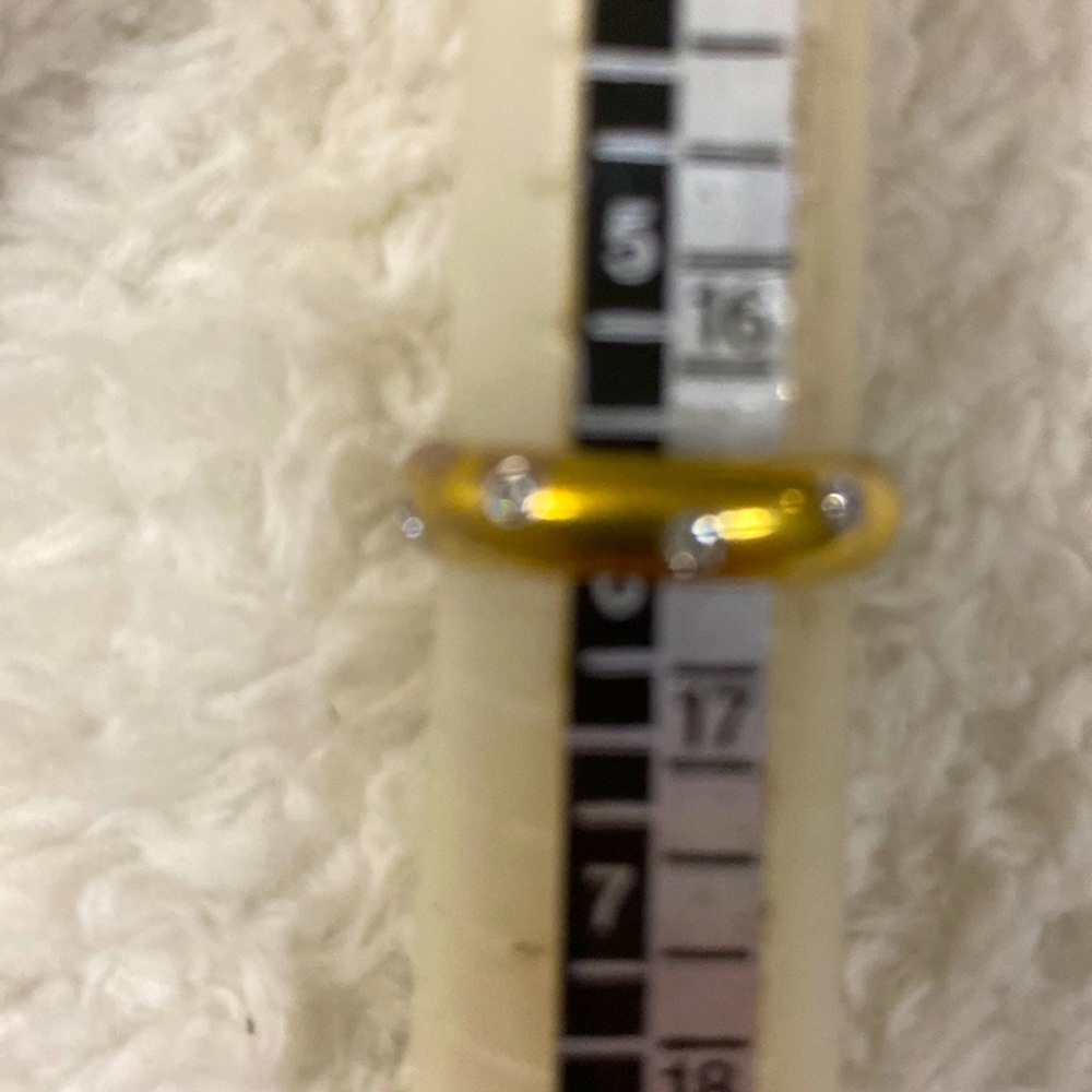Tiffany and company, size 6. 950 gold with 9 platinum bails around diamonds.